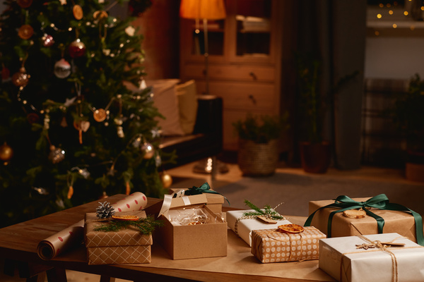 Presents and Wrapping paper on Background of Christmas Tree and Room